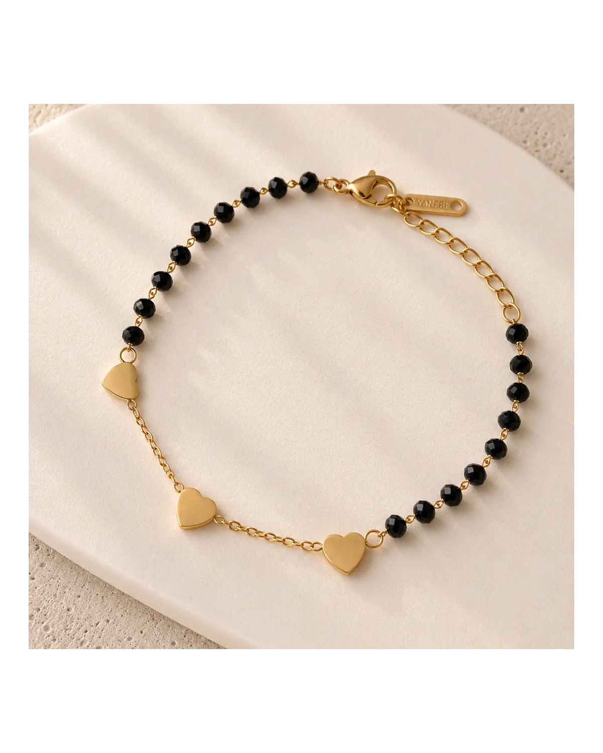 Bransoletka na rękę stal chirurgiczna pozłacana 14k złotem, czarne kuleczki, serce BST1751 Bransoletka na rękę stal chirurgiczna pozłacana 14k złotem, czarne kuleczki, serce BST1751